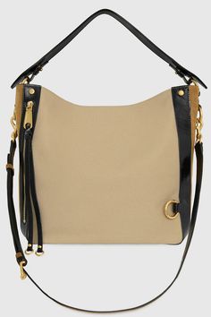 Crafted in canvas and trimmed in leather and accented with antique brass hardware, the M. A. B. Hobo Bag is spacious enough for your laptop and then some. Plus, the adjustable shoulder strap can be worn as a crossbody, so it will lighten the weight you’re carrying. Style #:HS24TCVHBO Cotton with genuine leather trim Antique Brass Hardware 11" W X 11" H X 6. 5" D Detachable Strap: Strap Drop 17. | Rebecca Minkoff M.A.B. Surplus Hobo Bag In Trench/Honey/Black Rectangular Hobo Bag With Brass Hardware For Travel, Brown Canvas Hobo Bag With Leather Trim, Canvas Shoulder Bag With Gold-tone Hardware, Crossbody, Canvas Crossbody Shoulder Bag With Gold-tone Hardware, Everyday Canvas Bag With Metal Hardware, Travel Hobo Bag With Brass Hardware In Satchel Shape, Beige Shoulder Bag With Brass Hardware For Travel, Travel Hobo Bag With Brass Hardware, Travel Tote Hobo Bag With Brass Hardware