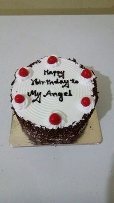 a birthday cake with the words happy birthday to my angel on it and cherries