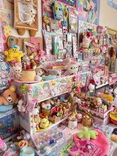 a room filled with lots of stuffed animals and other toys on top of shelves next to each other