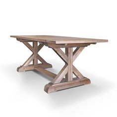 a wooden table sitting on top of a white floor