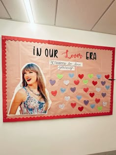 a bulletin board with the words i'm our love era written on it in front of a white wall