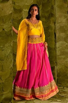 Shocking pink lehenga skirt with silk tape, woven border, aari gold zari beaten hand embroidery, beads work, zardozi, sequins, and gota patti, with floral embroidered dandelion yellow broad waistband. Comes with embroidered dandelion yellow blouse and dupatta. - Aza Fashions Transitional Pink Raw Silk Lehenga, Pink Choli For Designer Wear And Transitional Season, Transitional Pink Raw Silk Choli, Transitional Designer Pink Choli, Pink Silk Choli With Pallu, Transitional Pink Silk Lehenga, Transitional Season Pink Silk Lehenga, Pink Art Silk Lehenga For Transitional Season, Transitional Pink Art Silk Lehenga