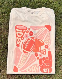 Get this popular NEW touchdown season shirt and show off your team spirit in style!  Each shirt is printed in-house by me using high-quality materials on a Comfort Colors shirt, known for its exceptional comfort, style, and durability. Available in unisex sizes S to 3X, and youth sizes, we've got you covered regardless of your preferred fit. This football game day shirt features a classic crew neck and short sleeves, making it suitable for year-round wear. The flattering silhouette ensures a com Cheap School Spirit Shirt For Game Day, Playoff Shirt Ideas, Game Day Apparel, Athletic T Shirt Design, Sports Graphic Tees, Alumni Tshirt Design Ideas, Bulldog Shirts School Spirit, Club Tshirt Designs, School Merchandise Ideas