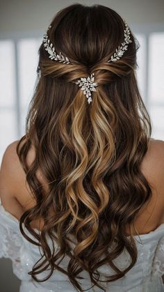 a woman with long hair wearing a bridal headpiece