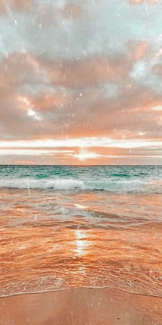 an orange and blue sky over the ocean