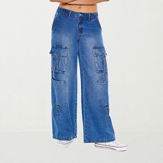 This pair of Forever 21 women's and junior's denim cargo pants combines two classic off-duty items - jeans and cargos - into one. Crafted from a soft denim blend in a medium wash, this mid-rise pair has an elasticated waist with a button-zip fly, utility pockets, a baggy-fit and wide legs. Team it with a fitted crop top to balance the silhouette. Closure Type: Button & ZipperPockets: 4 Cargo Side Pockets, 2 Front Slip PocketsRise: Mid RiseFiber Content: 83% Cotton, 9% Rayon, 8% PolyesterFabric D Fitted Crop Top, Denim Cargo Pants, Jean Color, Denim Cargo, Utility Pockets, Wide Legs, Baggy Fits, Off Duty, Jeans Straight Leg