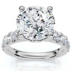 a white gold engagement ring with diamonds on it