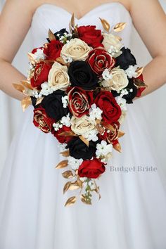 a bridal bouquet with red, white and black flowers