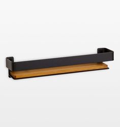 a black shelf with a wooden shelf underneath it