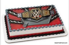 a cake with a wrestling logo on top and red, white, and blue icing