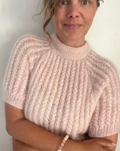 https://www.popknit.net/products/twist-and-shout-tee-english Yarn Fashion, Sweaters To Crochet, Short Sleeve Knit Sweater, Summer Knitting Patterns, Knitting Top, Cable Pattern, Modern Knitting, Cable Knitting