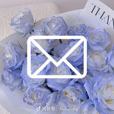 a bouquet of blue roses sitting on top of a table next to a thank card