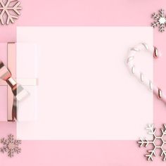 a pink and white background with presents, snowflakes, and candy canes