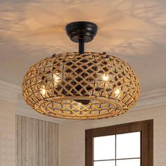 a round light fixture hanging from the ceiling