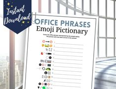 office phrases emoji dictionary displayed in front of large window with cityscape