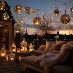 an outdoor deck with lights and lanterns