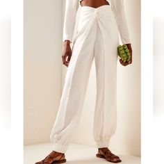 Nwt$620 Silvia Tcherassi Raimondo Knot Twist White Linen Pants Sz Medium Silvia Tcherassi "Raimondo" Pants With V-Shape Knot Twist Waistline Mid Rise Balloon Legs Cropped At The Ankle Elastic Cuffs Back Zip Viscose/Polyester Elastane/Polyester Lining Made In Colombia 14" Waist 12" Rise 18" Hips Brand New From Saks Fifth Avenue!! Strikeout To Prevent Returns Back To Saks. 100% Authentic With Original Tags!! Tags: Fall, Autumn, Halloween, Winter, Christmas, Holidays. Spring, Summer. Birthday Gift Women Wide Leg Pants, Holiday Pants, White Linen Pants, Autumn Halloween, Summer Birthday, Pants Casual, Italian Fabric, Unique Designers, Twist Front