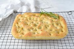 a loaf of bread sitting on top of a cooling rack