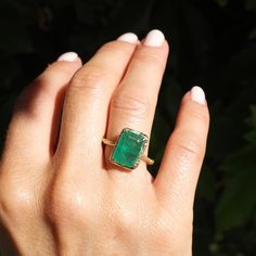 This Zambian emerald ring is set in 14k gold willow branch wire with diamonds scattered along the bezel. Emeralds are known to have qualities of growth, reflection. love and peace. Willows are know for their ability to bend without breaking. Handmade in Los Angeles 14k yellow gold 4.14 carats Diamonds 14x10.5mm Zambian Emerald Ring, Emerald Stone Engagement Ring, Forest Ring, Emerald Forest, Emerald Rings, Willow Branches, Love And Peace, Zambian Emerald, 5th Anniversary