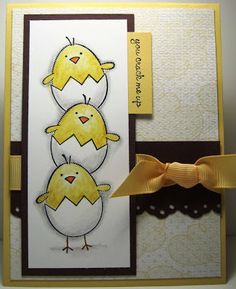 a card with two chicks on it and a ribbon tied around the bottom of each card