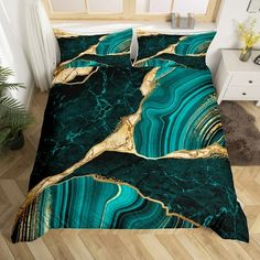 a bed with green and gold marble pattern on it