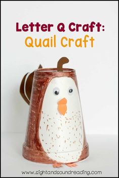 a paper cup with a penguin on it and the words letter a craft quail craft