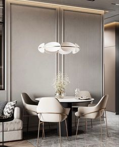 an elegant dining room with white chairs and a round table surrounded by gray striped walls