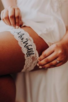 a woman wearing lace garters with the words i can't wait on her