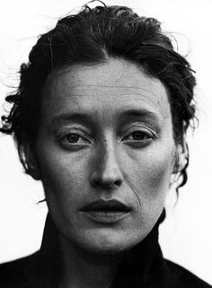 an old black and white photo of a woman with freckles on her face