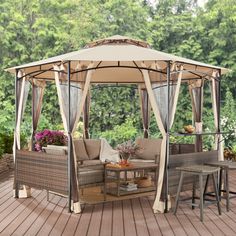 a gazebo on a deck with chairs and tables