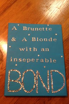 a wooden sign that says, a brunette and a blonde with an insepable bond