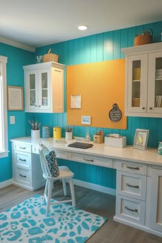 a kitchen with blue and yellow walls, white cabinets and a rug on the floor