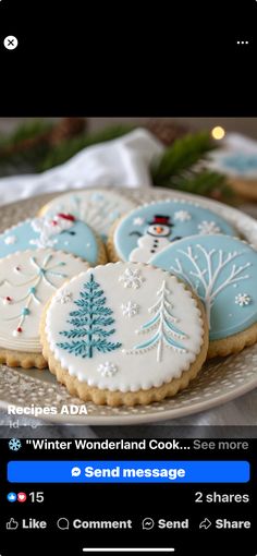 some cookies are on a plate with snowflakes and trees in the middle,