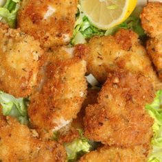 some fried food is on a plate with lettuce