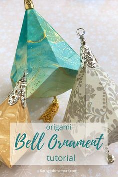 three origami bell ornaments with text overlay