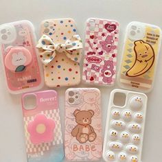 there are many cell phones that have different designs on them, and one has a bow