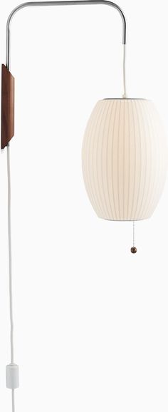 a wall light with a white ball on the side and a wooden pole attached to it