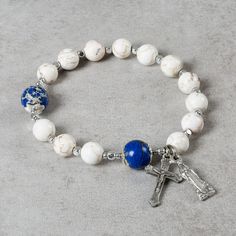 Lourdes Rosary Bracelet | The Catholic Company Spiritual Beaded Bracelets With Miraculous Medal, Spiritual Bracelets With Miraculous Medal As Gift, White Spiritual Rosary Bracelet, Spiritual Rosary Bracelet With Miraculous Medal, Adjustable Crucifix Spiritual Bracelet, Adjustable Natural Stones Rosary Bracelet, Adjustable Spiritual Rosary Bracelet With Natural Stones, Spiritual Cross Bracelets, Spiritual Silver Rosary Bracelet With Natural Stones