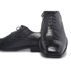 When it comes to achieving a perfect business-like persona, one of the most significant accessories is the shoes. These black leather shoes are the right choice for all the reasons. Firstly, the beautiful handiwork on the exterior gives them a unique touch. Secondly, being black, these shoes are as versatile as they get. Here’s a lot more about these brilliant men’s black Brogue Oxfords by the LeatherSkin Shop. Genuine leather official black formal shoes with a flexible style and design that only adds to the aura. Shiny wrinkled exterior with immaculate finishing paired with a classy light brown interior for amazing looks. Padding and lining are done on the insole while black expert threading visible on the exterior only adds to your style quotient. The central lace-up system is quite prac Elegant Black Wingtip Lace-up Shoes, Elegant Closed Toe Lace-up Shoes For Derby, Leather Lace-up Shoes With Brogue Detailing For Party, Luxury Black Wingtip Lace-up Shoes, Luxury Formal Lace-up Shoes With Leather Sole, Luxury Wingtip Lace-up Shoes For Galas, Black Cap Toe Leather Shoes For Formal Occasions, Black Calf Leather Oxfords With Almond Toe, Elegant Lace-up Cap Toe Shoes For Galas