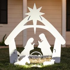 a nativity scene with the birth of jesus and baby jesus in a manger