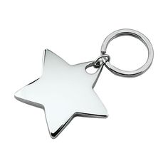 a silver star shaped key chain on a white background