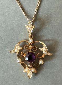 Beautiful Victorian 15ct Gold Amethyst Heart Pendant. This superb quality Pendant has a beautiful coloured amethyst measuring 6mm x 6mm. It is a really pretty design set with natural seed pearls as was typical of the Victorian era. This is very wearable piece of Antique Jewellery in excellent condition. The hallmark is rubbed down but 15ct can be seen. Pendant is on a lovely fully hallmarked 9ct gold chain measuring 46cm. The pendant measures 3.3cm x 2.5cm including the bale. Total Weight 5.1g P Vintage Amethyst Jewelry, Antique Victorian Jewelry, Formal Heart Cut Amethyst Jewelry, Yellow Gold Amethyst Heart Cut Jewelry, Purple Heart Cut Jewelry For Formal Events, Purple Heart Cut Jewelry For Formal Occasions, Formal Purple Heart-shaped Jewelry, Purple Heart Jewelry For Formal Occasions, Formal Amethyst Jewelry For Valentine's Day