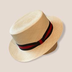 A little bit of History President Roosevelt wore one of the hats while visiting the Panama canal. His photograph was seen around the world and this accessory piece became known as the "Panama Hat". Panama Hats are made in Ecuador by local artisans. About the Product Straw Panama Hats is a summer essential, made in Ecuador. The hat has a statement ribbon around the crown of the hat.  Size Small-approx. 21.5 inches Size Medium-approx. 22 inches Size Large-approx. 22.5 inches Hat comes with the ribbon (Please note, I can not change the ribbons) Quality, Control & Sustainability The Panama Hats are made in Ecuador since 1630. Woven by craftsmen utilizing natural fibers and materials called "toquilla straws". How to Protect your Panama Hat * Do not wear your hat in water or in heavy rain as it Straw Panama Hat, Panama Canal, Straw Hats, Heavy Rain, Summer Essential, Local Artisans, Support Handmade, Ribbon Colors, Red Ribbon