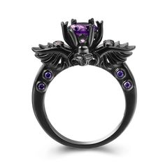 Gothic skull and wings punk ring with purple gem in a claw setting. A beautiful piece that really stands out from the rest. A stunning design with rich violet brilliant-cut gem. Details Item Type: Fashion Rings Metal Type: Brass Material: Cubic Zirconia Width: 22mm Luxury Gothic Rings For Halloween, Luxury Gothic Jewelry Ring, Enchanting Gothic Rings, Cheap Gothic Rings For Halloween, Purple Goth Rings, Purple Skull Ring, Luxury Gothic Ring, Cheap Gothic Rings In Metal, Cheap Gothic Metal Rings