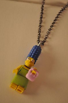 a lego figure is attached to a chain