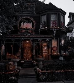 a house decorated for halloween with pumpkins and decorations