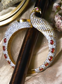 Swan cuff bracelet with red onyx & CZ stones Luxury Traditional Carved Cuff Bracelet, Crystal Cuff Bracelet, Gold Plated Bangles, Bridal Jewellery Indian, Stone Setting, Red Crystals, Onyx Stone, Red Stone, Crystal Stone