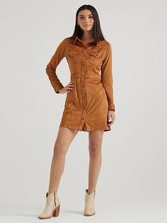 With a luxurious look and feel, the Women’s Wrangler Retro® Sueded Western Snap Shirt Dress will become your first pick for every special occasion. This vintage-inspired dress is crafted from a soft fabric blend with just a little stretch for extra comfort. It features all the Western-inspired details, including chest flap pockets with our signature ‘W’ stitching, pointed yokes from front to back, a banded waist for a flattering fit, and branded hardware for authenticity. Wrangler Women, Knee Sleeves, Retro Women, Dress Shirts For Women, Vintage Inspired Design, Inspired Dress, Stylish Dresses, Women's Dresses, Soft Fabric