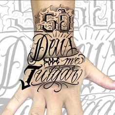 a hand with some writing on it and the words devil are tattoo written in black ink