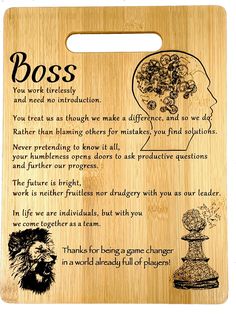 a wooden cutting board with an image of a person's head and the words boss on it